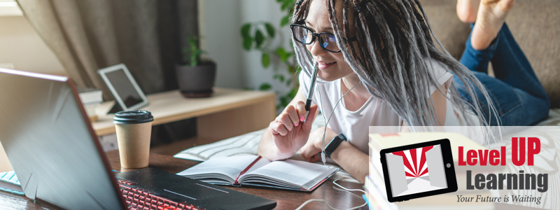 A woman studying online.